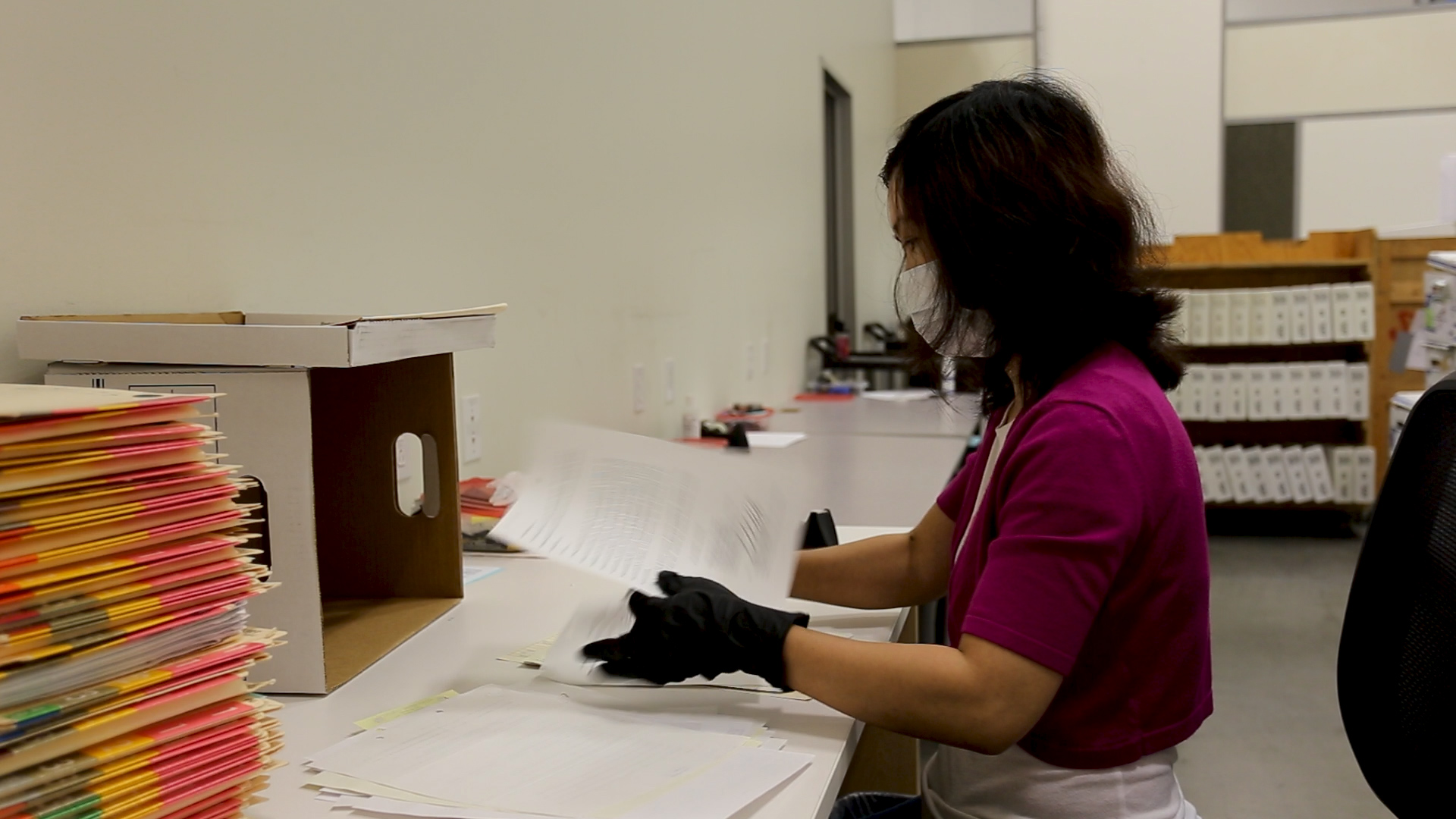 team reviewing digital records on screens as part of disaster recovery planning