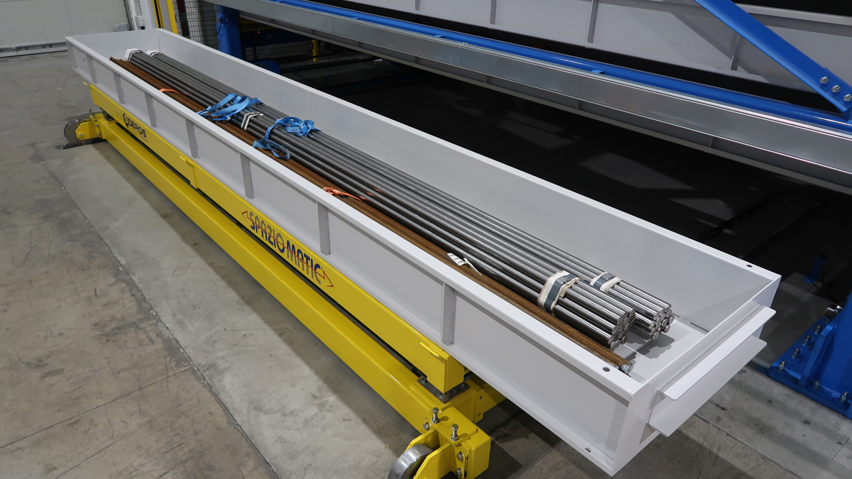 Automated shuttle for metal bar and tube storage systems in warehouses and distribution centers