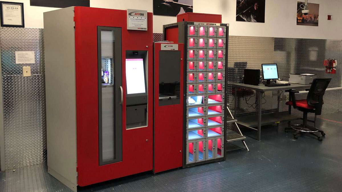 Close-up view of AutoLocker FX compartments showing stored industrial parts including nozzles and protective covers