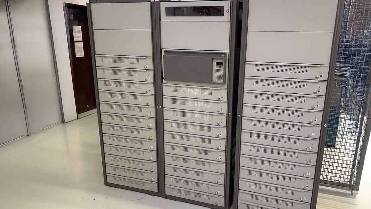 Vending machines in a military supply room at an air force base, designed for secure and efficient equipment storage