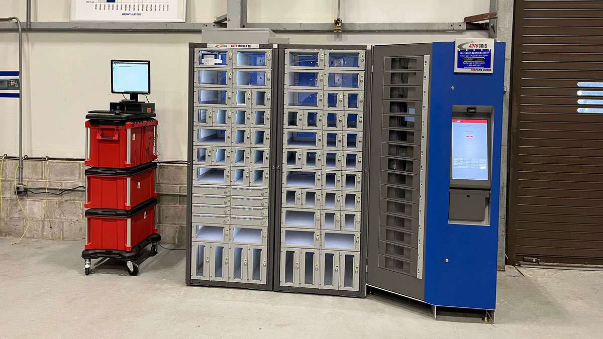 Blue AutoLocker vending machine system with visible compartments and integrated computer station for inventory monitoring