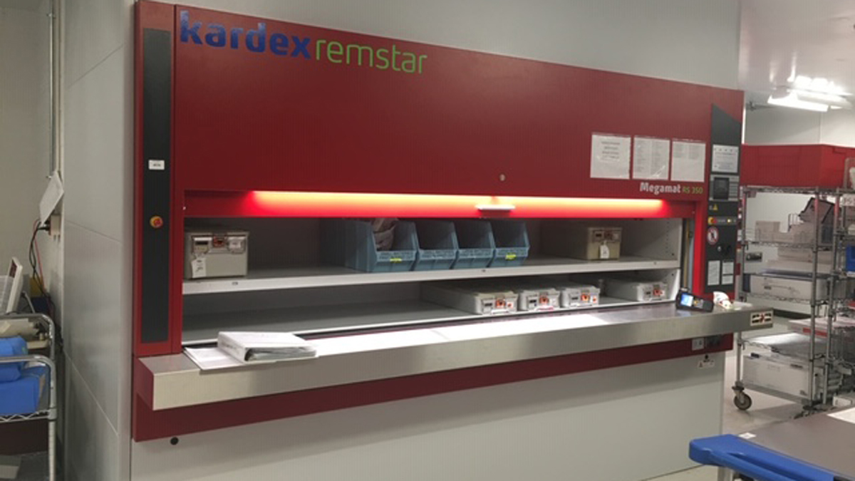 Enclosed vertical carousel carriers for sterile supply storage at counter-height access