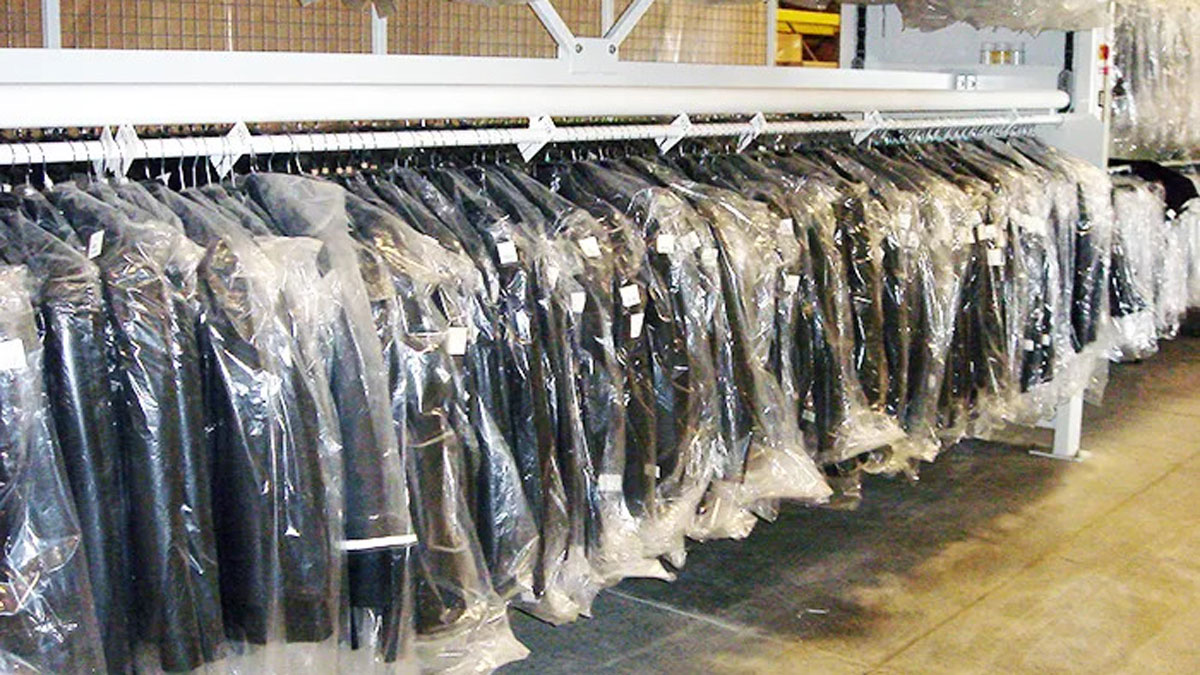 Motorized hanging garment carousel used for high-density clothing storage in retail or warehouse environments