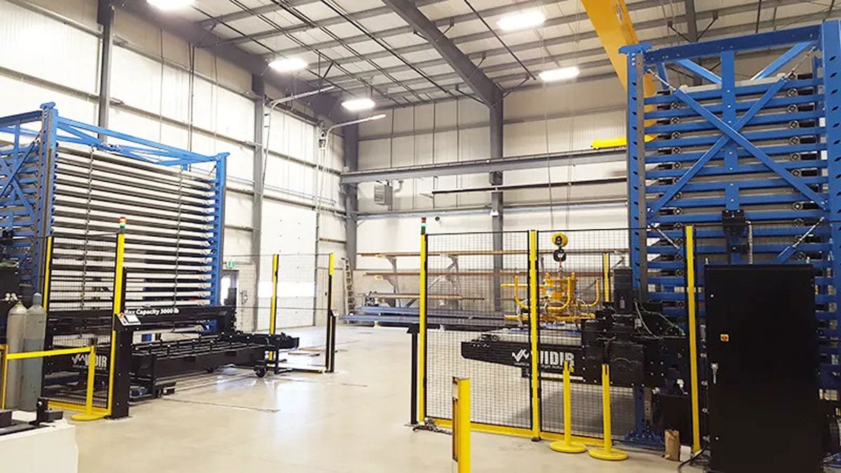 Automated vertical lift storing sheet metal pallets in a warehouse