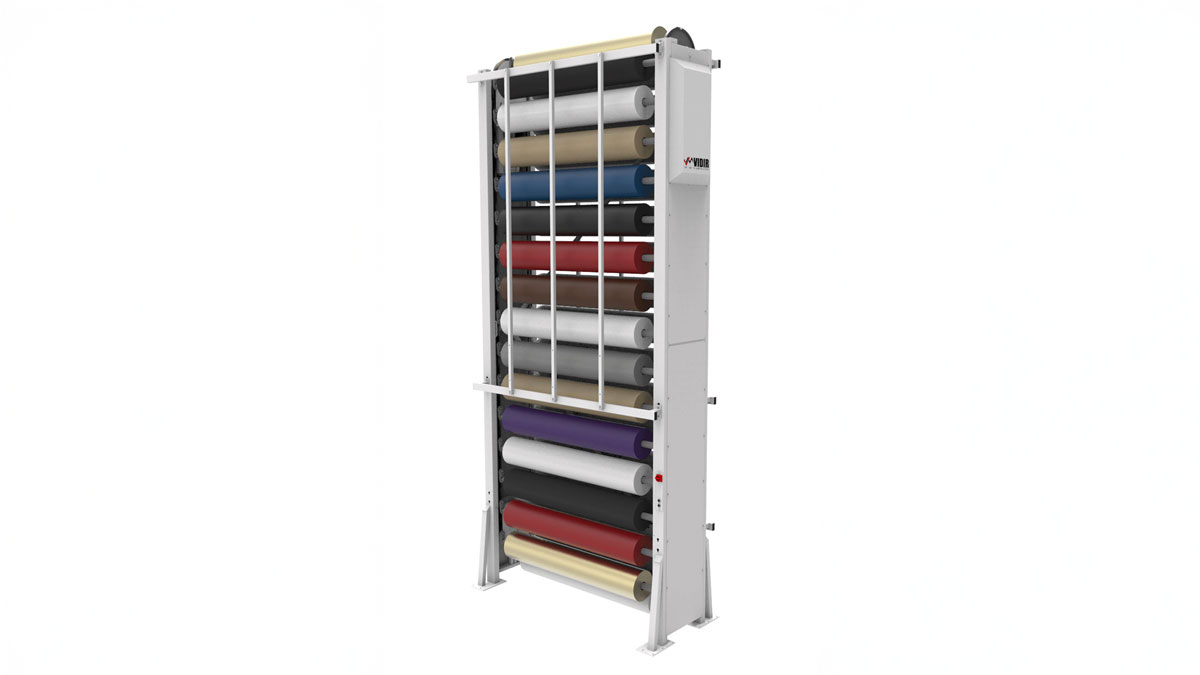 Vertical textile carousel storing multiple fabric rolls in a compact automated system for efficient fabric handling