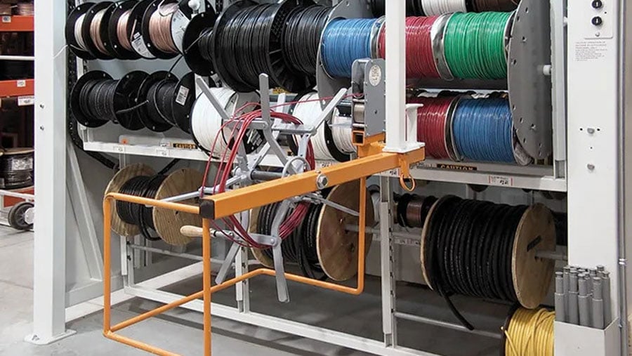 Wire spool carousel with cable length counter for precise dispensing
