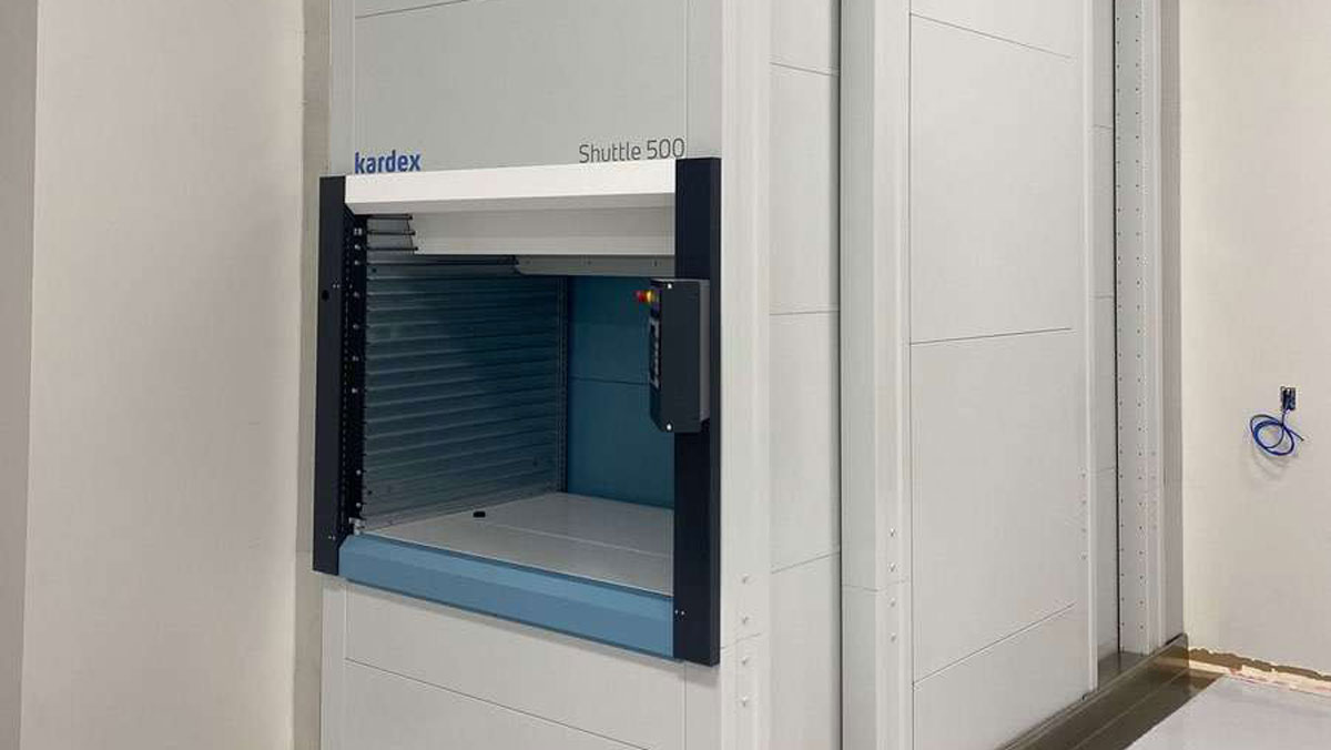 Kardex vertical lift module showing tray access during automated storage retrieval