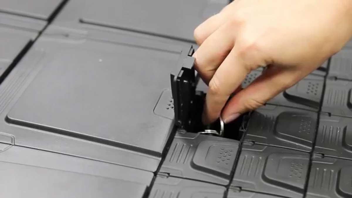 user inserting key fob into electronic key storage slot for secure management and tracking