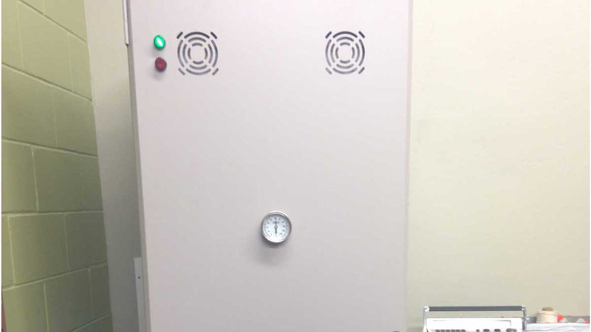 40-inch herbarium drying cabinet closed door featuring pressure gauge and vent fans for controlled drying environment