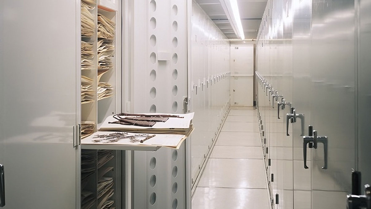 mobile aisle of herbarium cabinets model 241 showing pullout shelf with specimen folders for space-efficient storage
