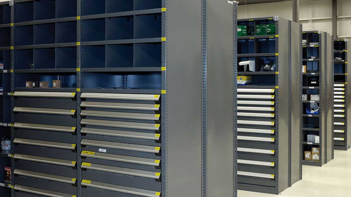 Modular drawers integrated into industrial shelving holding. 