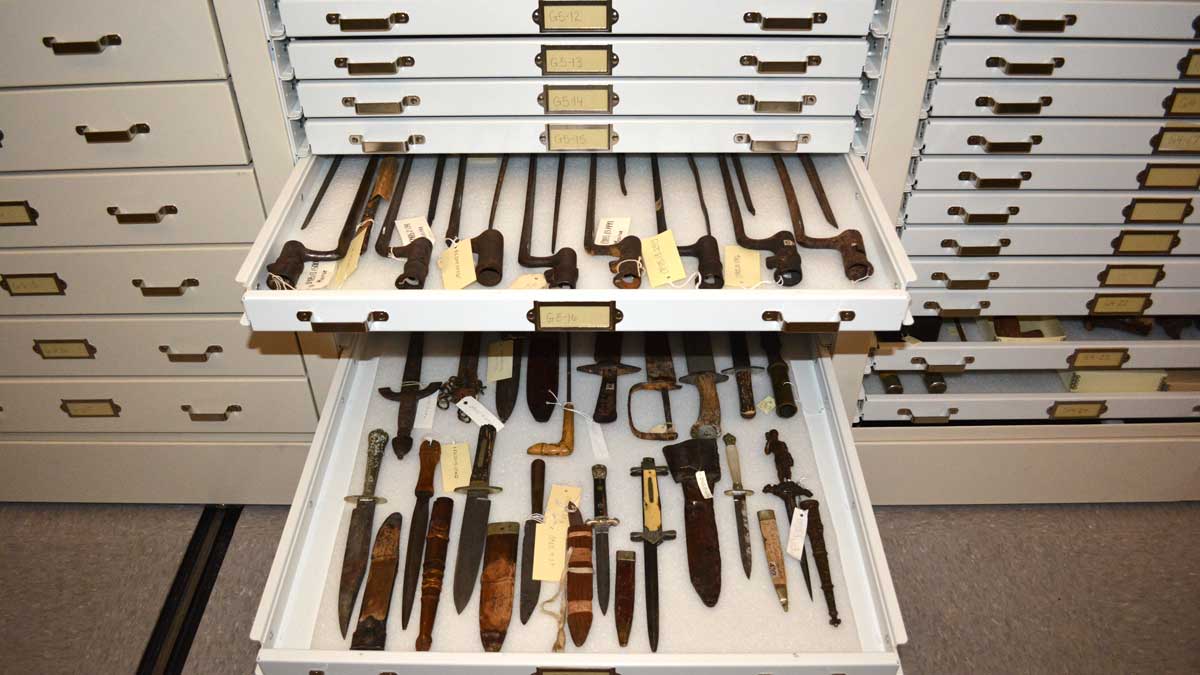 civil war weapon artifact bayonet stored in preservation cabinet for secure museum storage