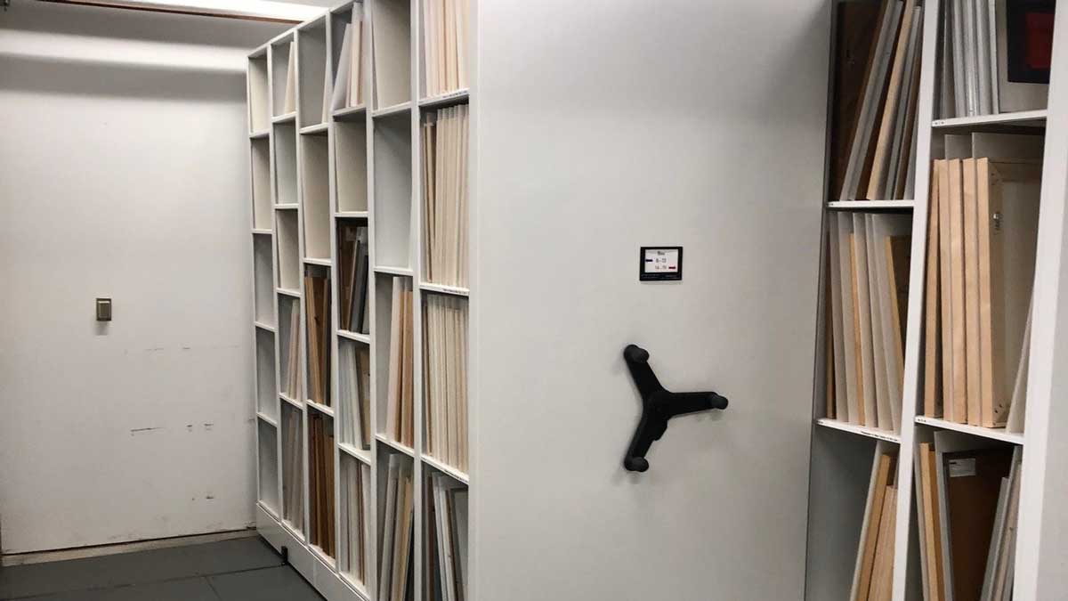 Glass-door museum cabinet used for visible storage at a modern art museum