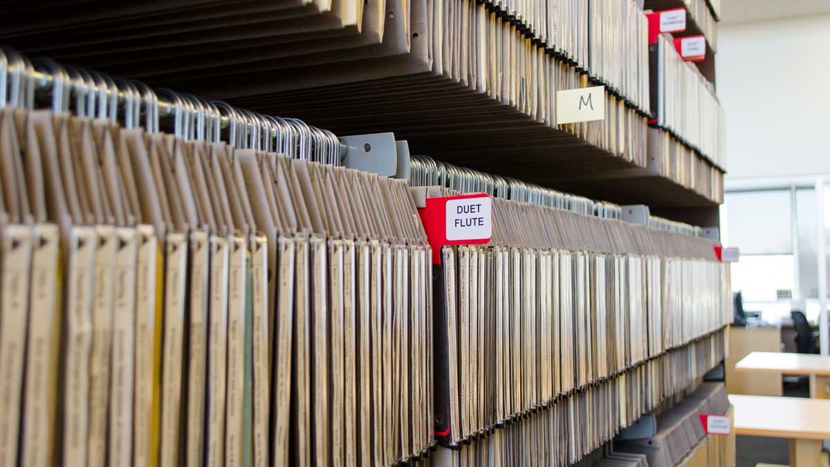 Music department storage shelves designed for organized and accessible sheet music storage.