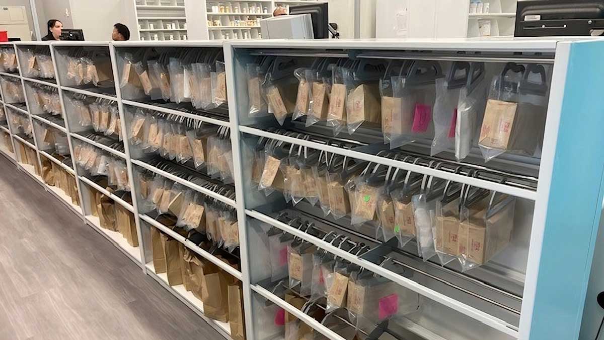 Organized storage solution for pharmacy medication bags in clear pouches