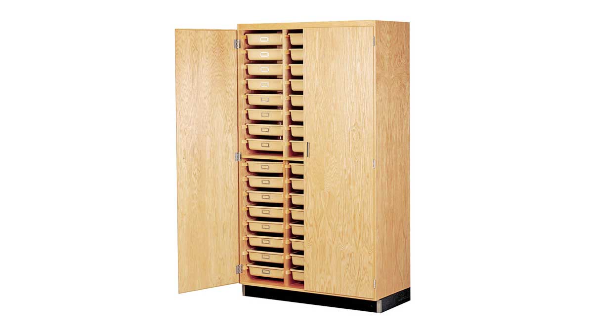 Wooden cabinet with multiple pull-out trays for organized item storage in offices or classrooms