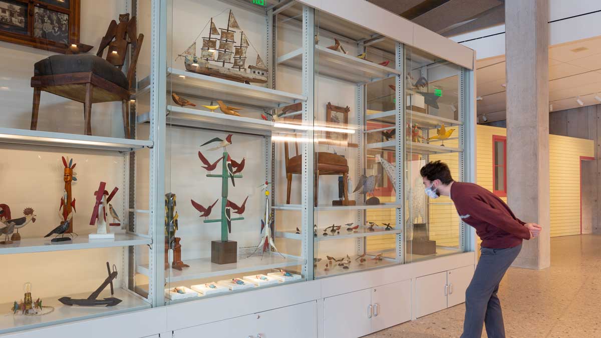 museum cabinet showcasing cultural artifacts in secure display cases