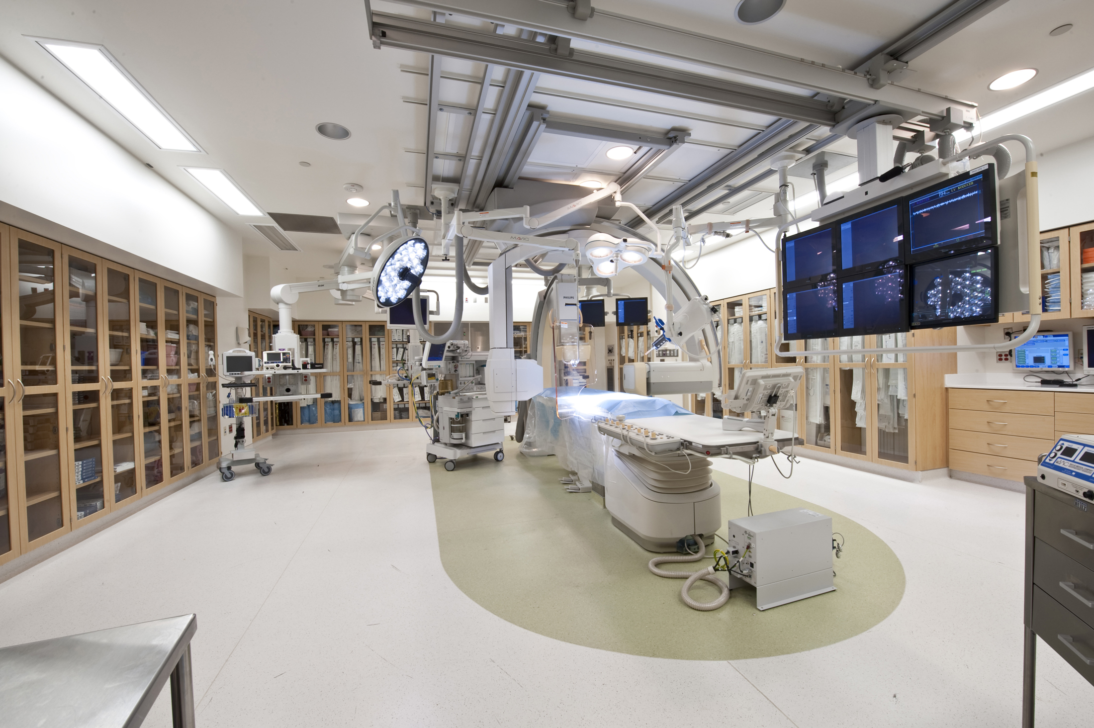 medical supply cabinets with glass doors and shelves for organized equipment storage in a healthcare facility