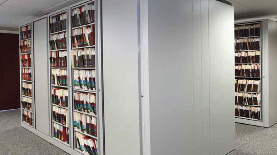 Full-height rotary file cabinets storing legal and medical documents in a high-capacity system