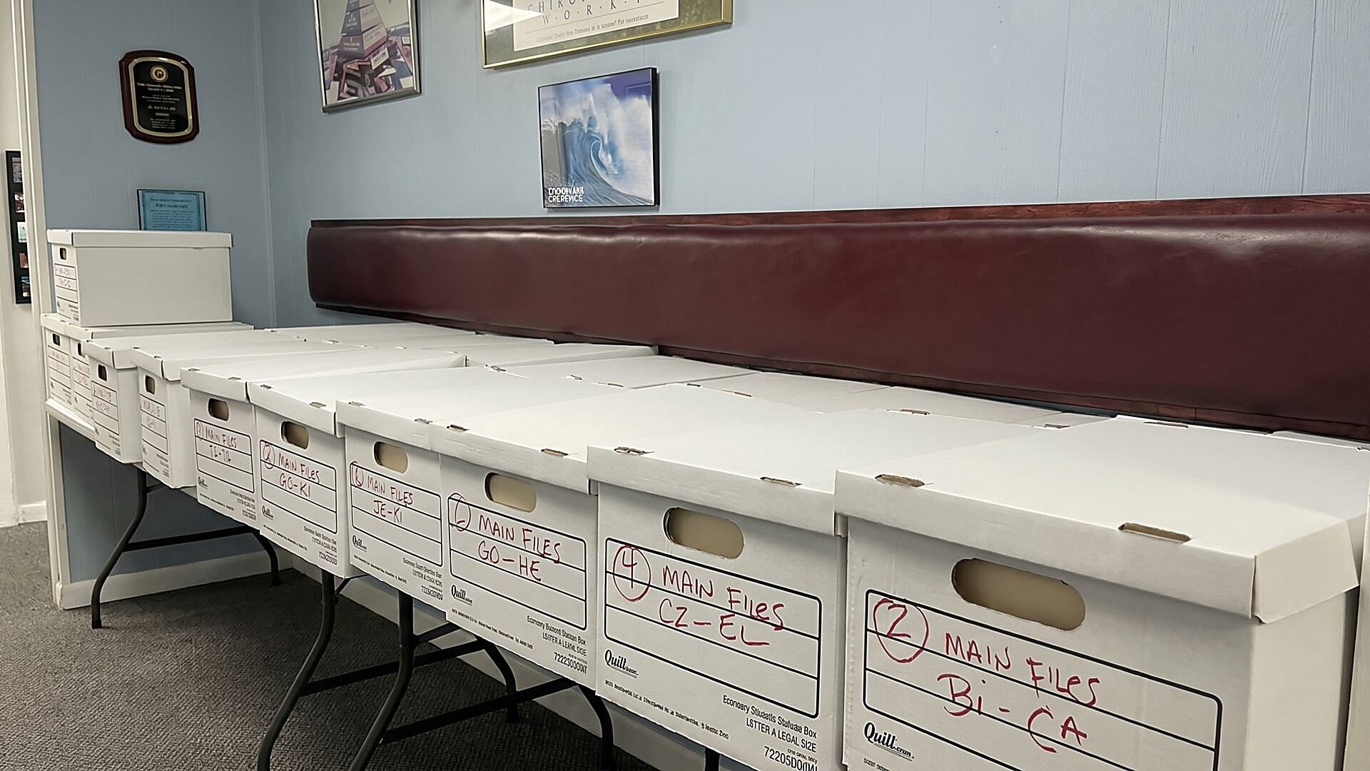 Boxed patient charts ready for digitization for medical records storage and improved document access