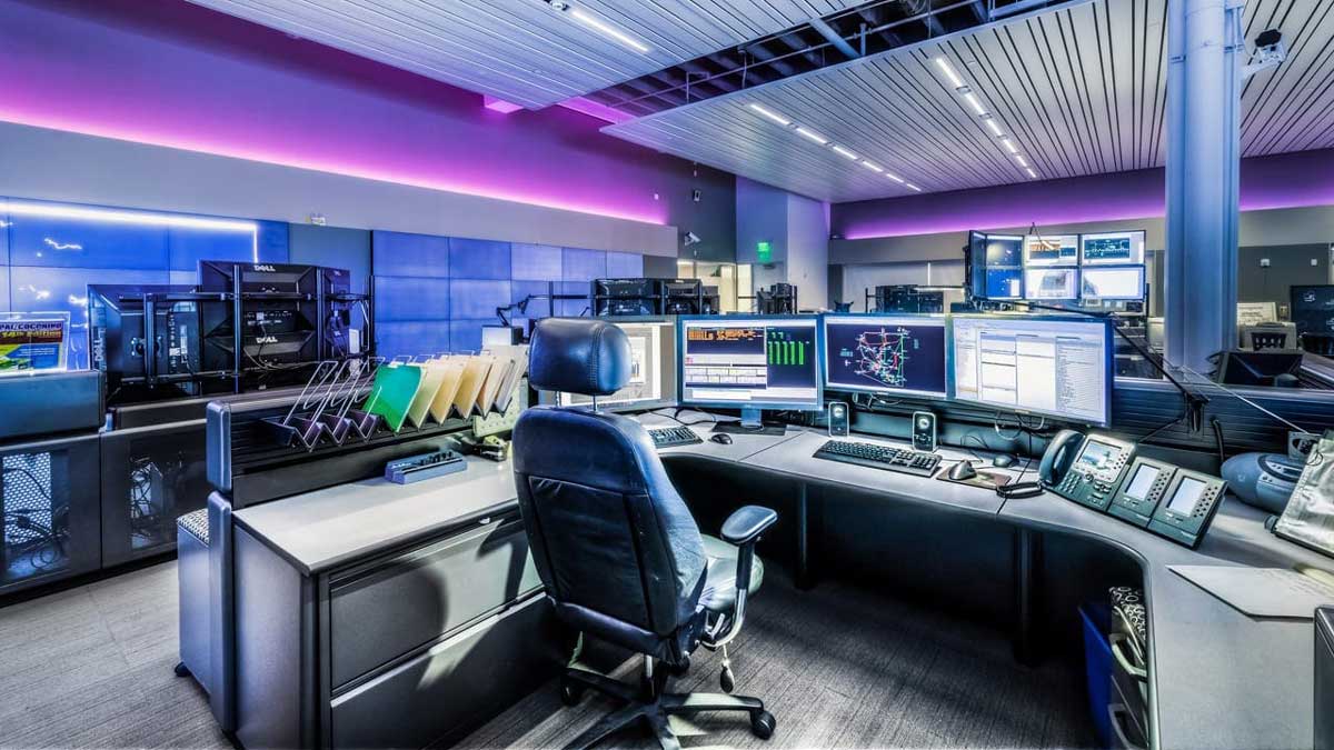 APS command center with modern control consoles and multiple display monitors