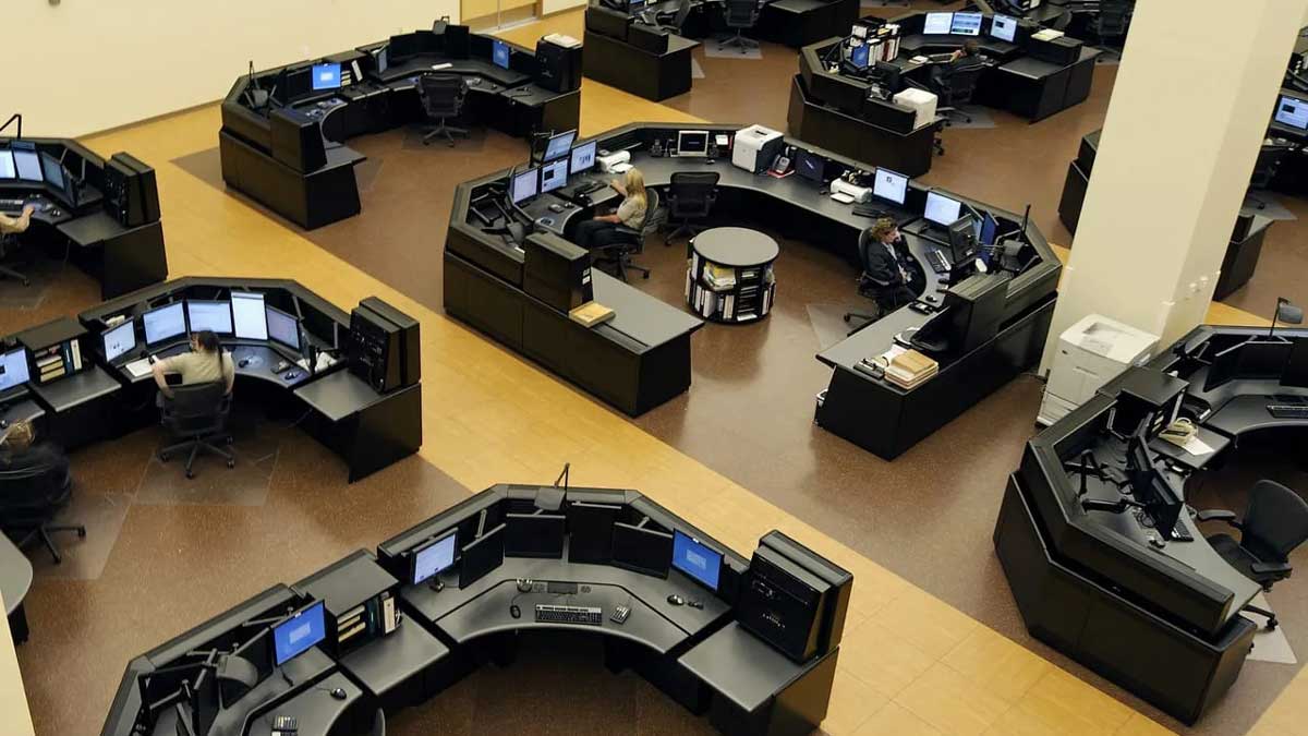 Public safety operations room with multiple screens and monitoring desks