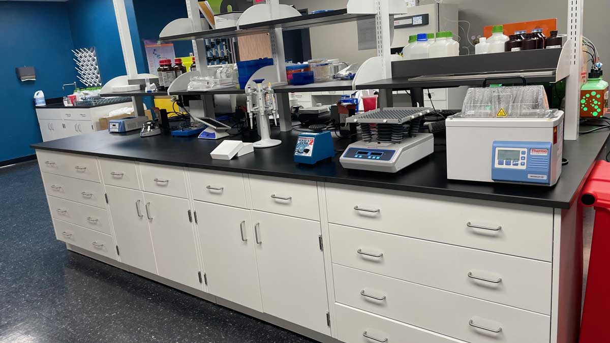 R&D lab with metal shelving and cabinets for organized storage
