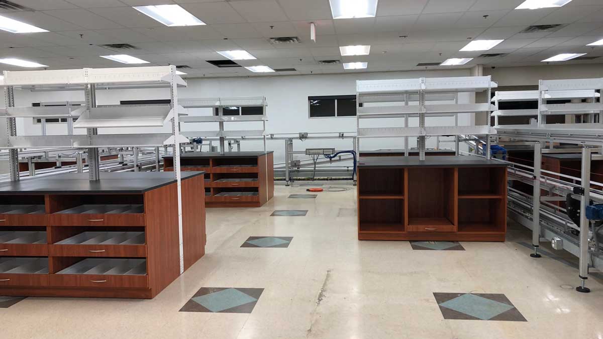Lab storage cabinets with built-in shelving and counters for ample storage and organized workspaces