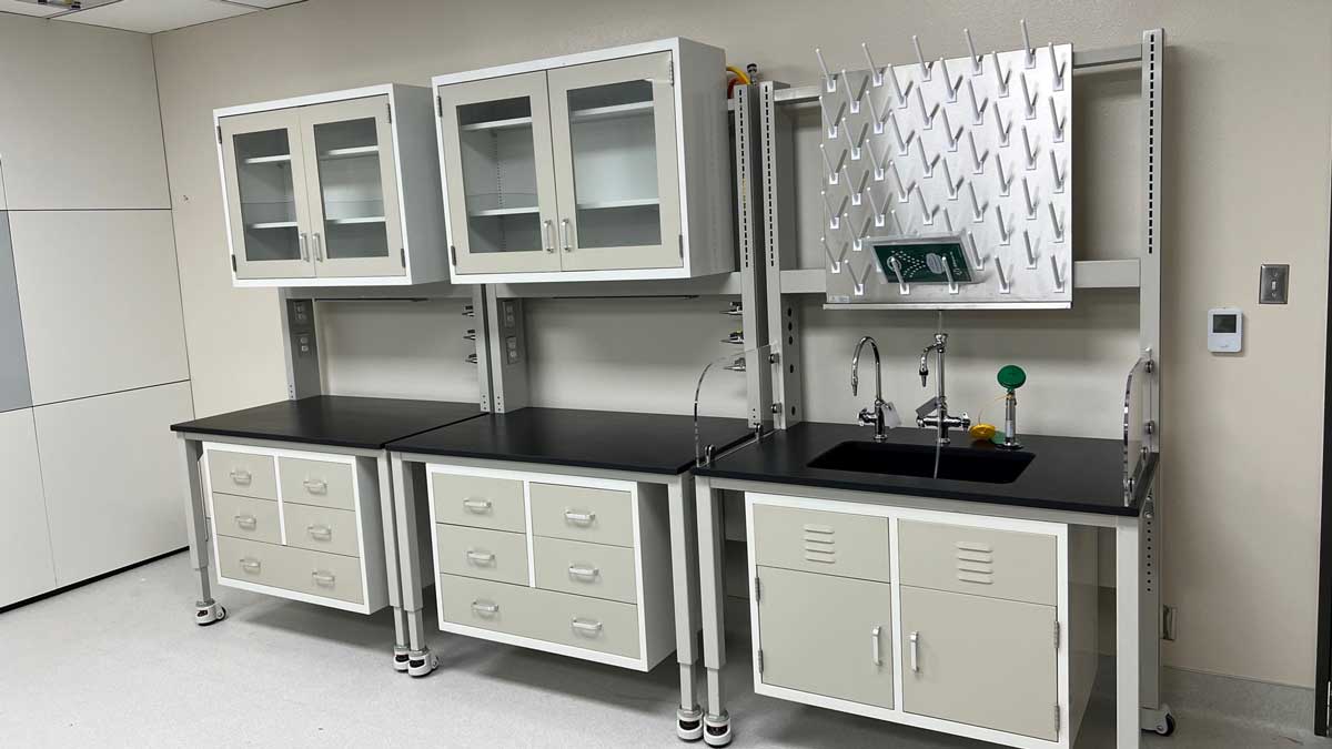 Lab upper cabinets featuring glass windows and multiple power outlets, ideal for safe storage and easy access