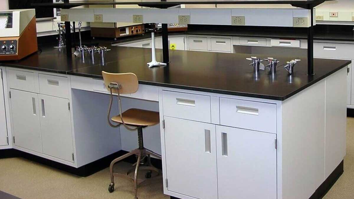 Powder-coated metal casework cabinets and worktop in an industrial support area