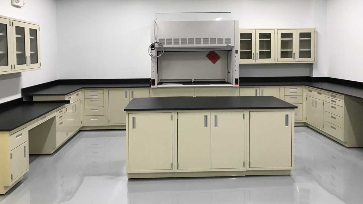 Stainless metal casework in a quality control lab with a fume hood