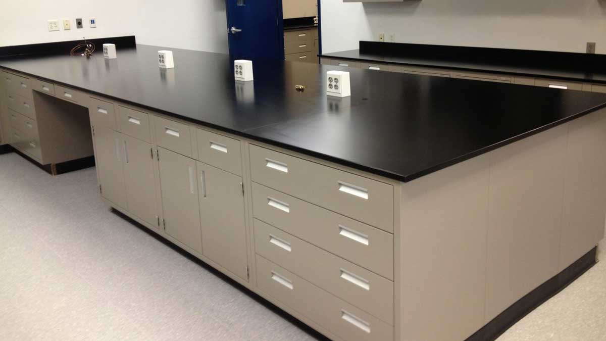 Stainless steel metal casework with drawers in a clinical workspace