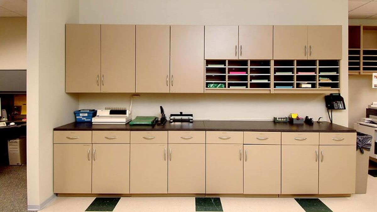 modular casework with upper and lower cabinets for copy print and fax station organization