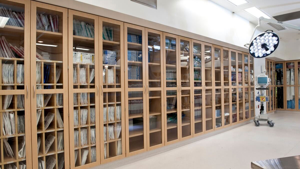 Healthcare modular casework with glass door cabinets used for storing medical records