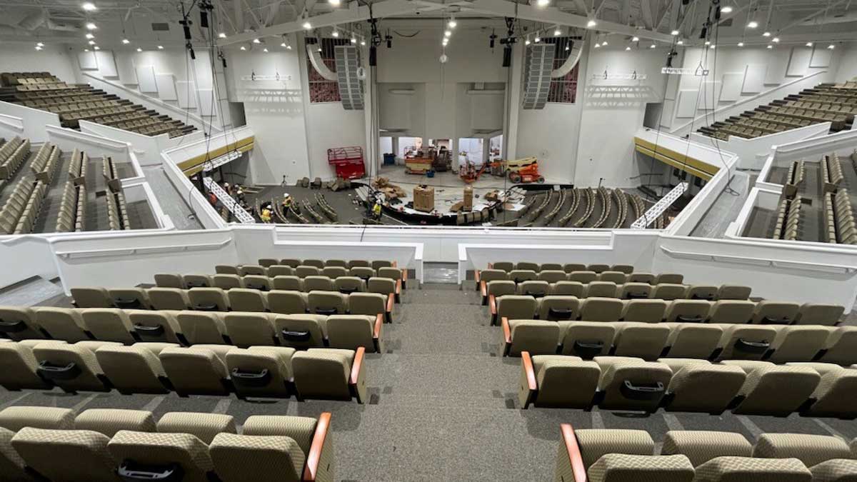 Church auditorium seating with classic padded chairs in neutral colors