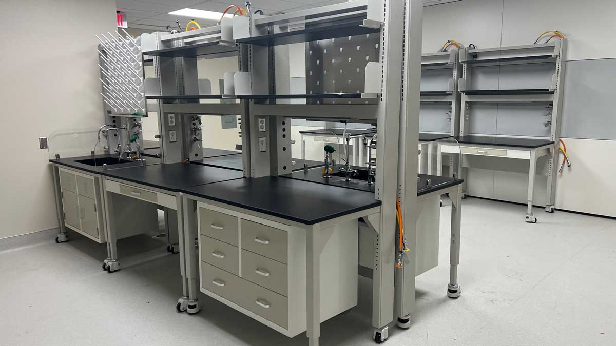 Vocational lab bench with upper shelving and drawers for tools, parts, and training materials