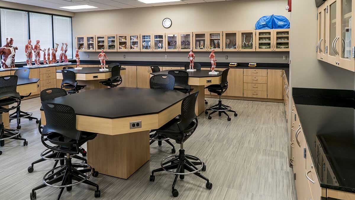 University laboratory benches with wooden cabinets, drawers, and storage for research equipment