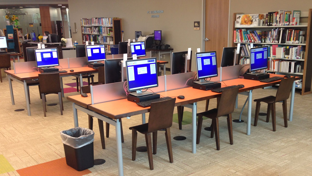 Library computer tables with integrated cable management