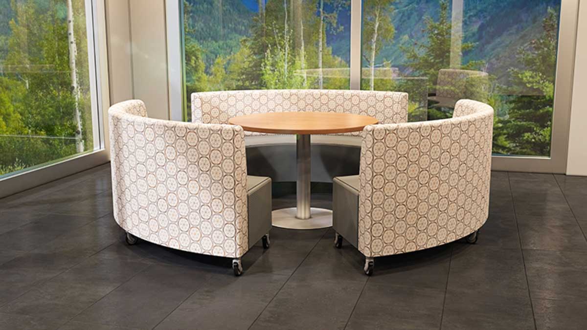 Library flexible study and seating space equipped with round tables and chairs to support collaborative learning and reading activities