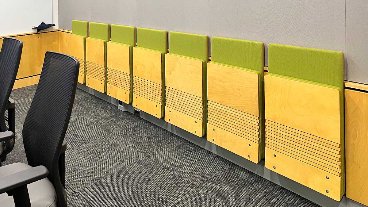 Wall-mounted folding jumpseat chairs for classrooms, healthcare, and corporate spaces