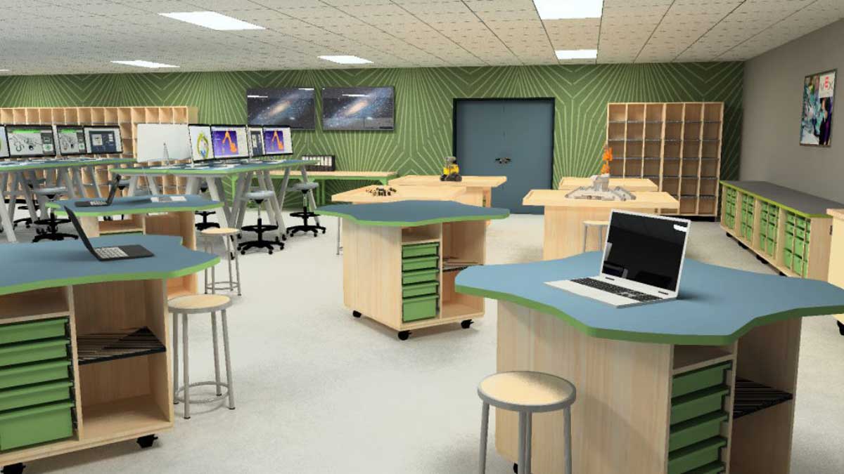 Modern makerspace classroom with worktables, stools, and technology workstations for collaborative learning