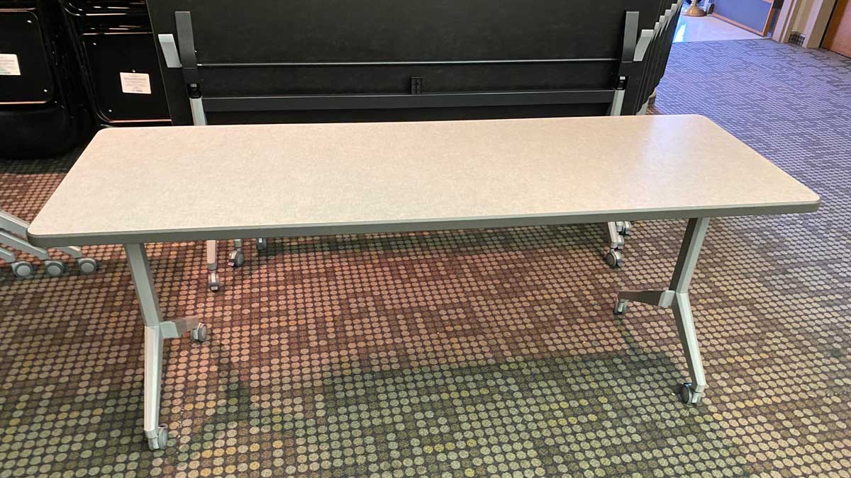 rectangular training table with caster legs designed for flexible classroom or meeting room setups