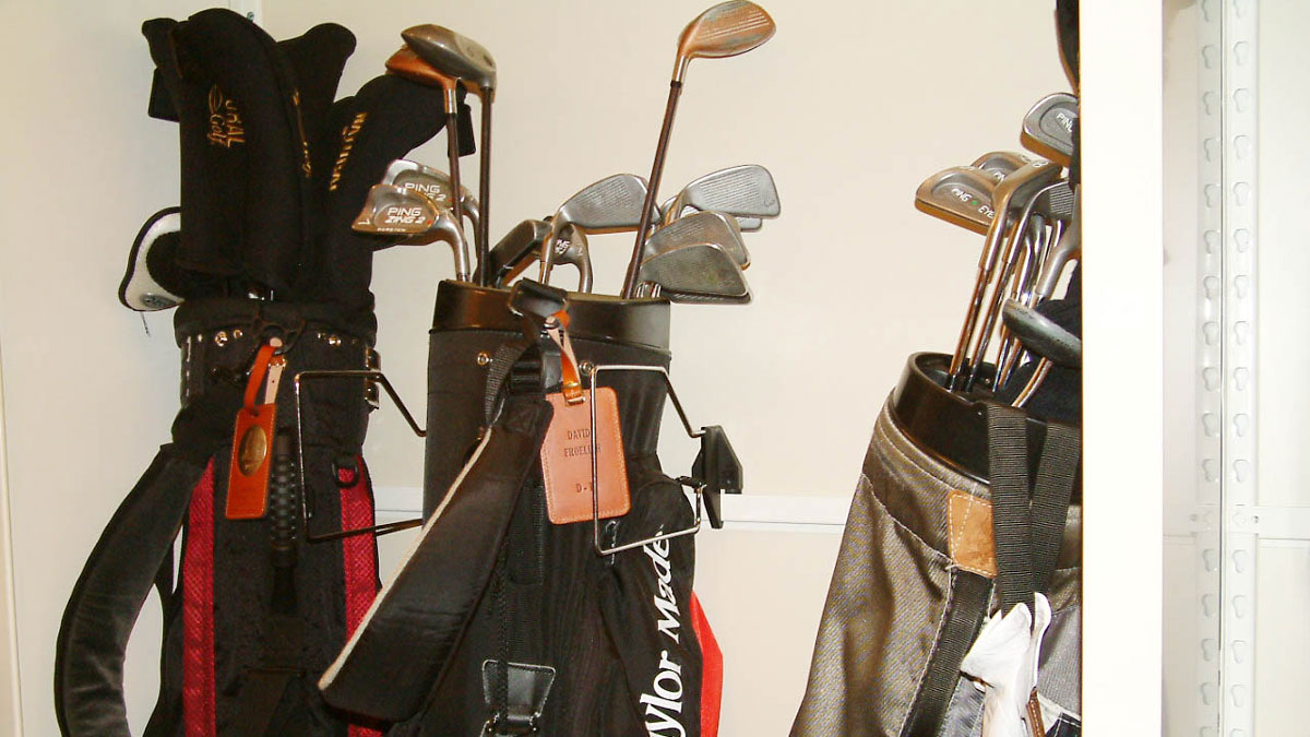 golf bag storage dimensions showing multiple golf bags with clubs organized inside storage space