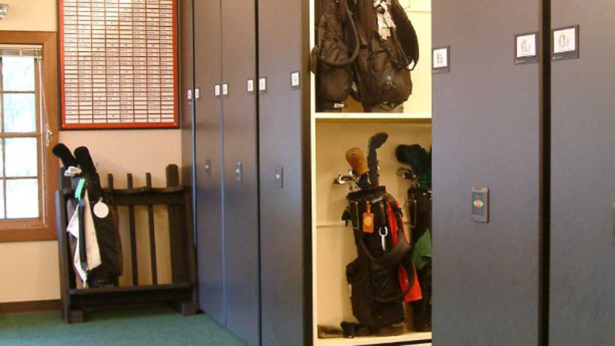 Powered mobile golf bag storage racks used as a guest amenity in a resort