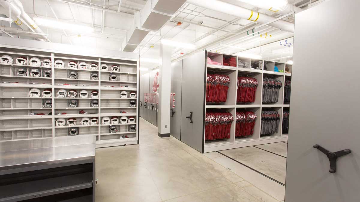 Mobile shelving storing football equipment