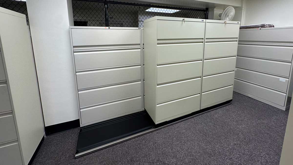 Sliding file cabinets in a county office for storing and accessing documents efficiently