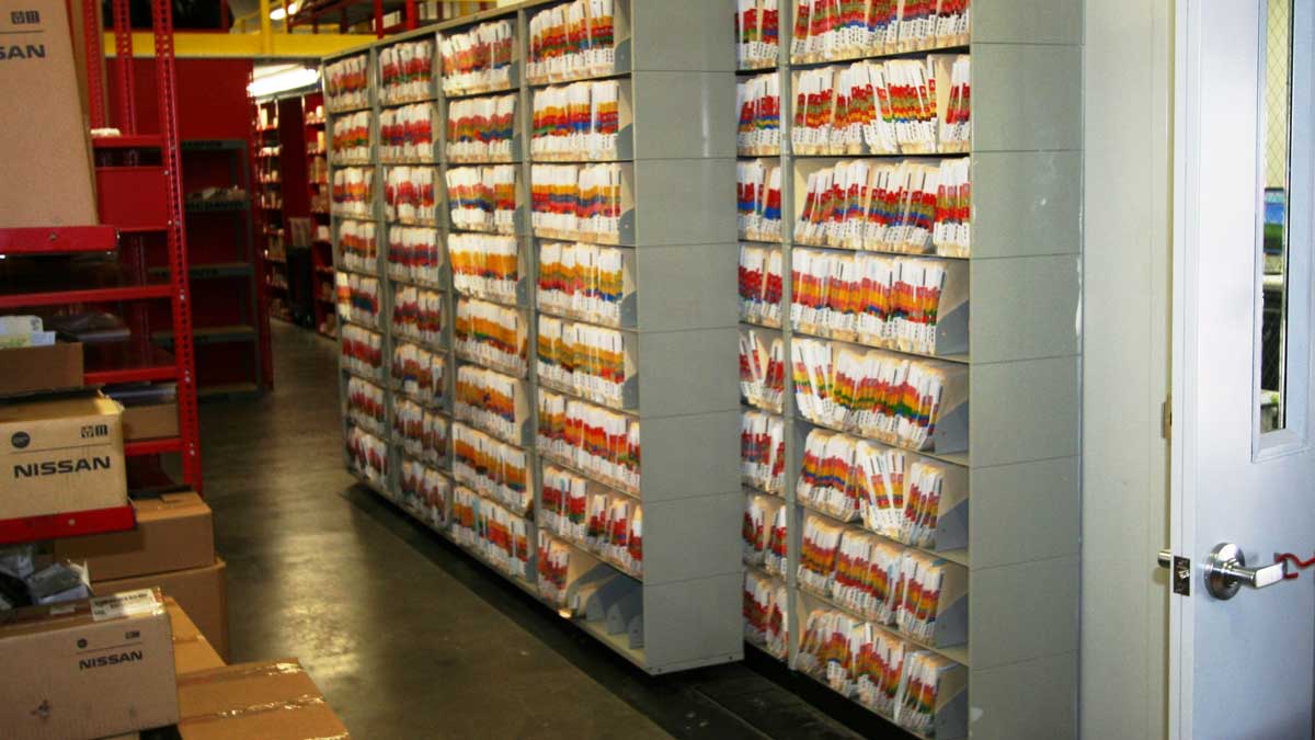 Sliding file shelves with color-coded folders