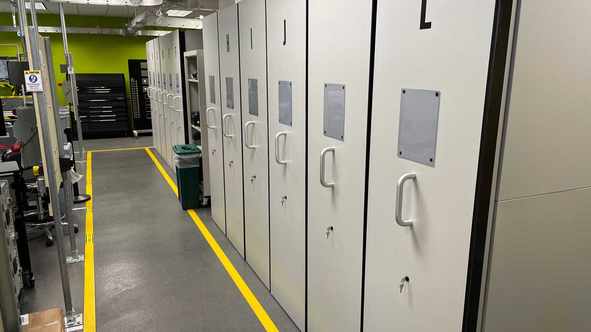 Pull-out cabinet system for lab storage solutions, maximizing aisle space and organizing tools efficiently