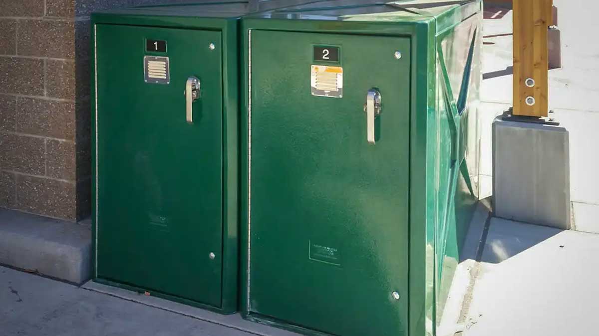 Pair of exterior bike lockers with two compartments and latch handles for locking
