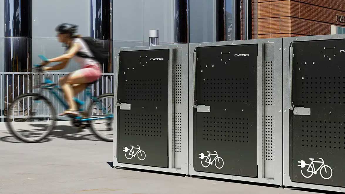 Front view of double-D2 series e-bike locker doors featuring charging-symbol decals and ventilated panels.